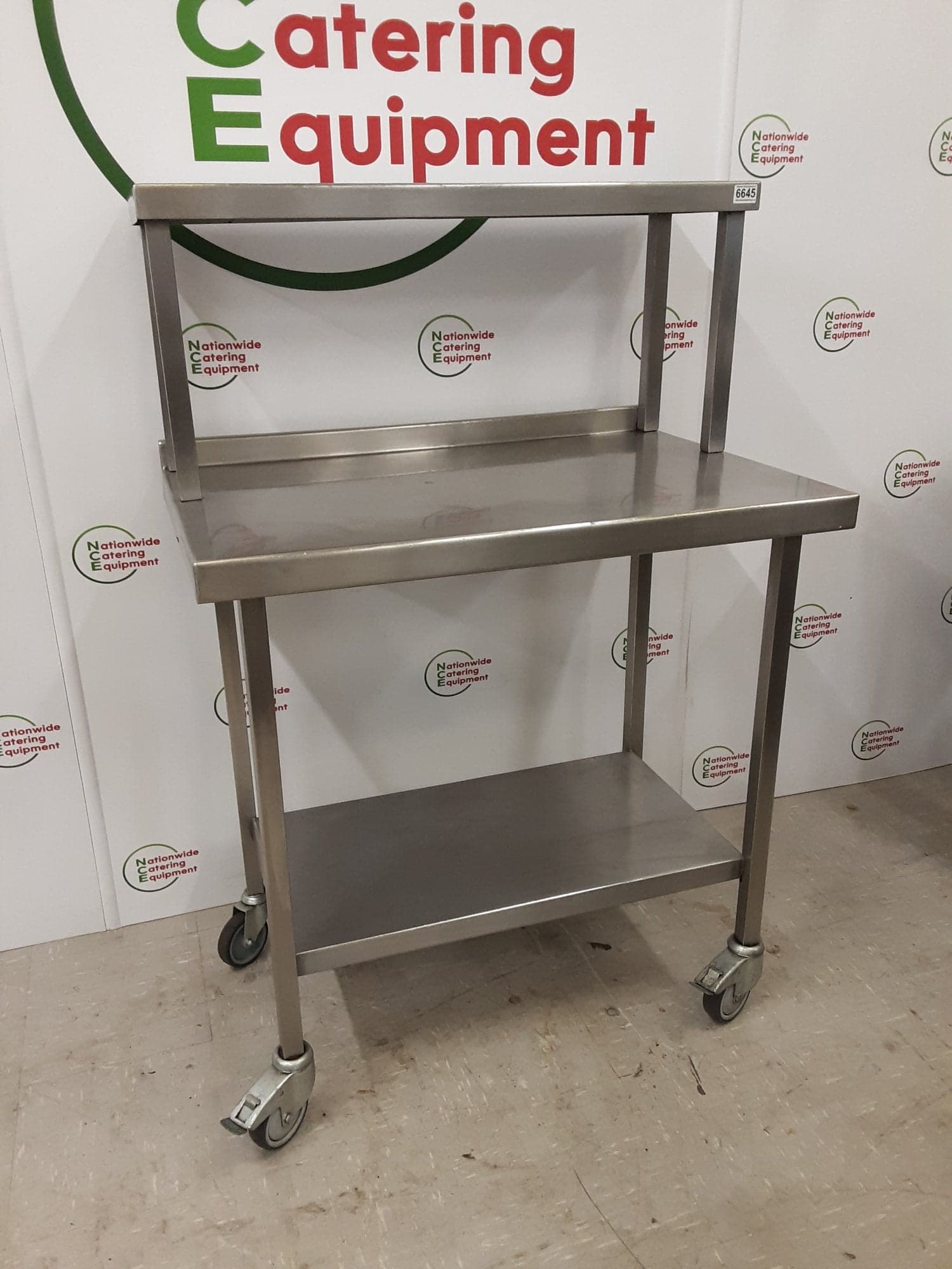 Stainless Steel Table On Wheels With Shelf Above — image 2