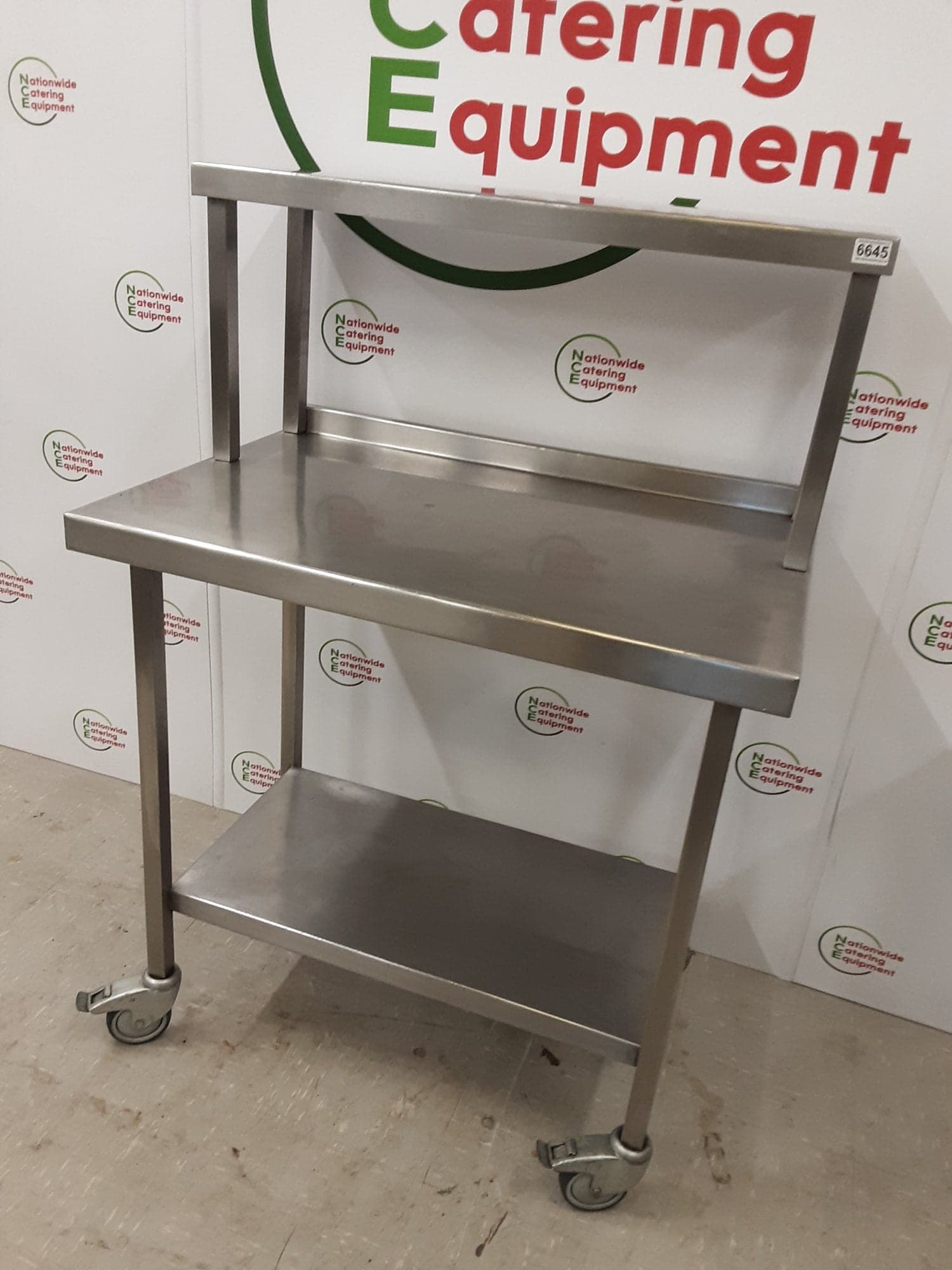 Stainless Steel Table On Wheels With Shelf Above — image 3