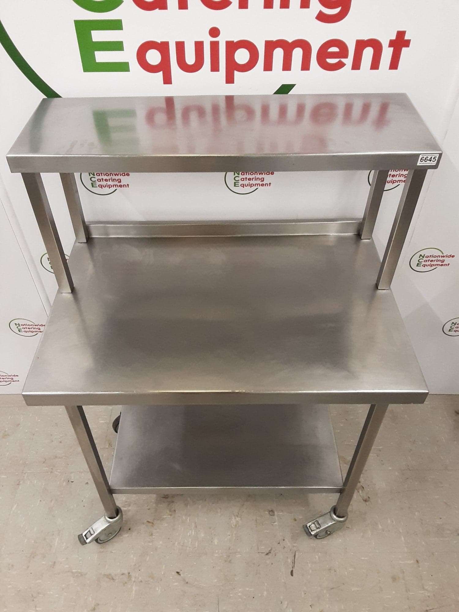 Stainless Steel Table On Wheels With Shelf Above — image 4